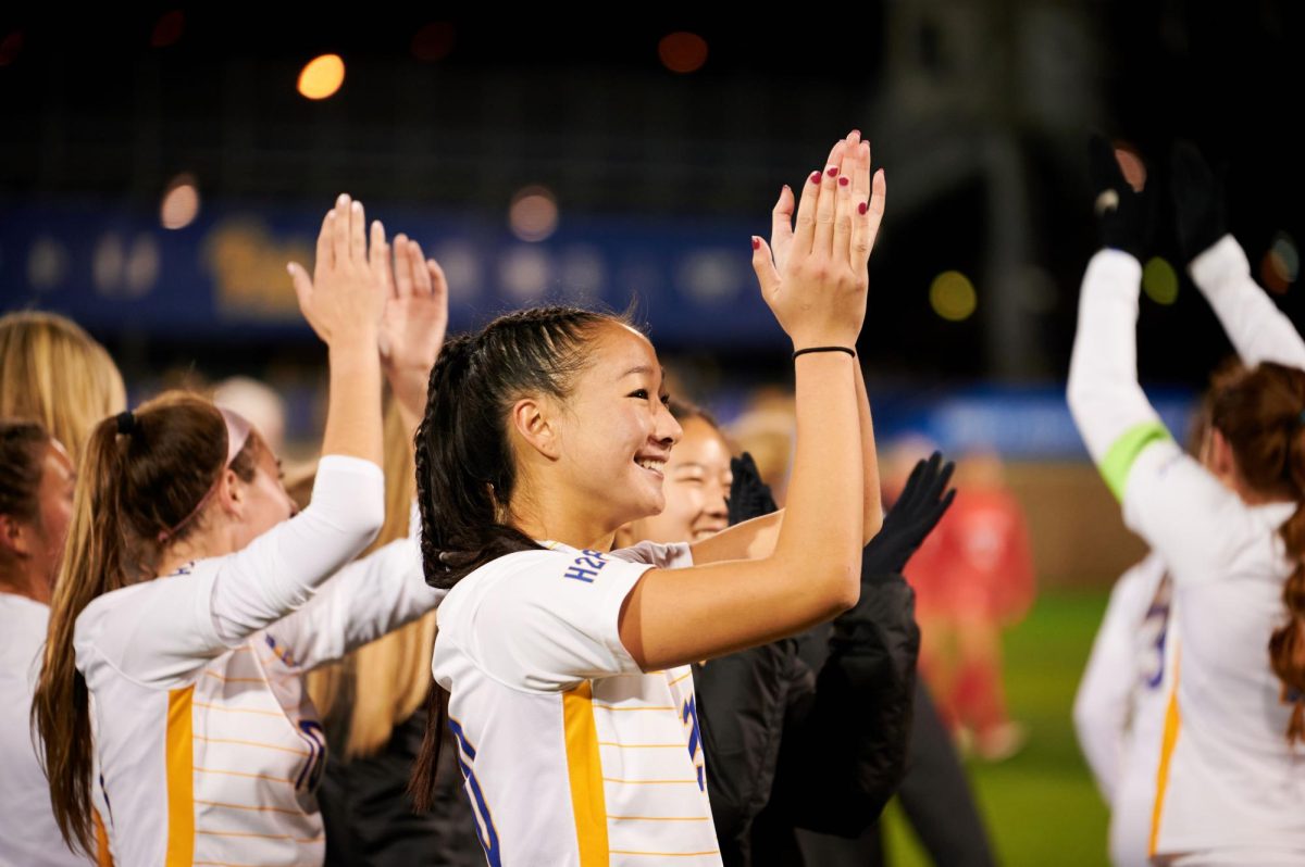 First year defender Olivia Lee (20) celebrates with teammates after their win against Ohio State in the first round of the NCAA tournament at the Petersen Sports Complex on Saturday.
